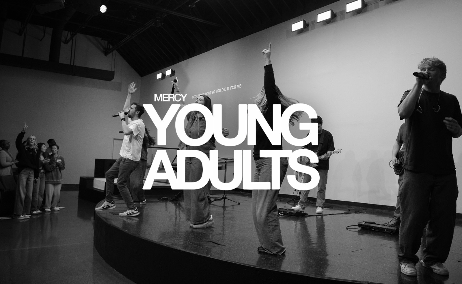 Mercy Young Adults logo over a worship gathering