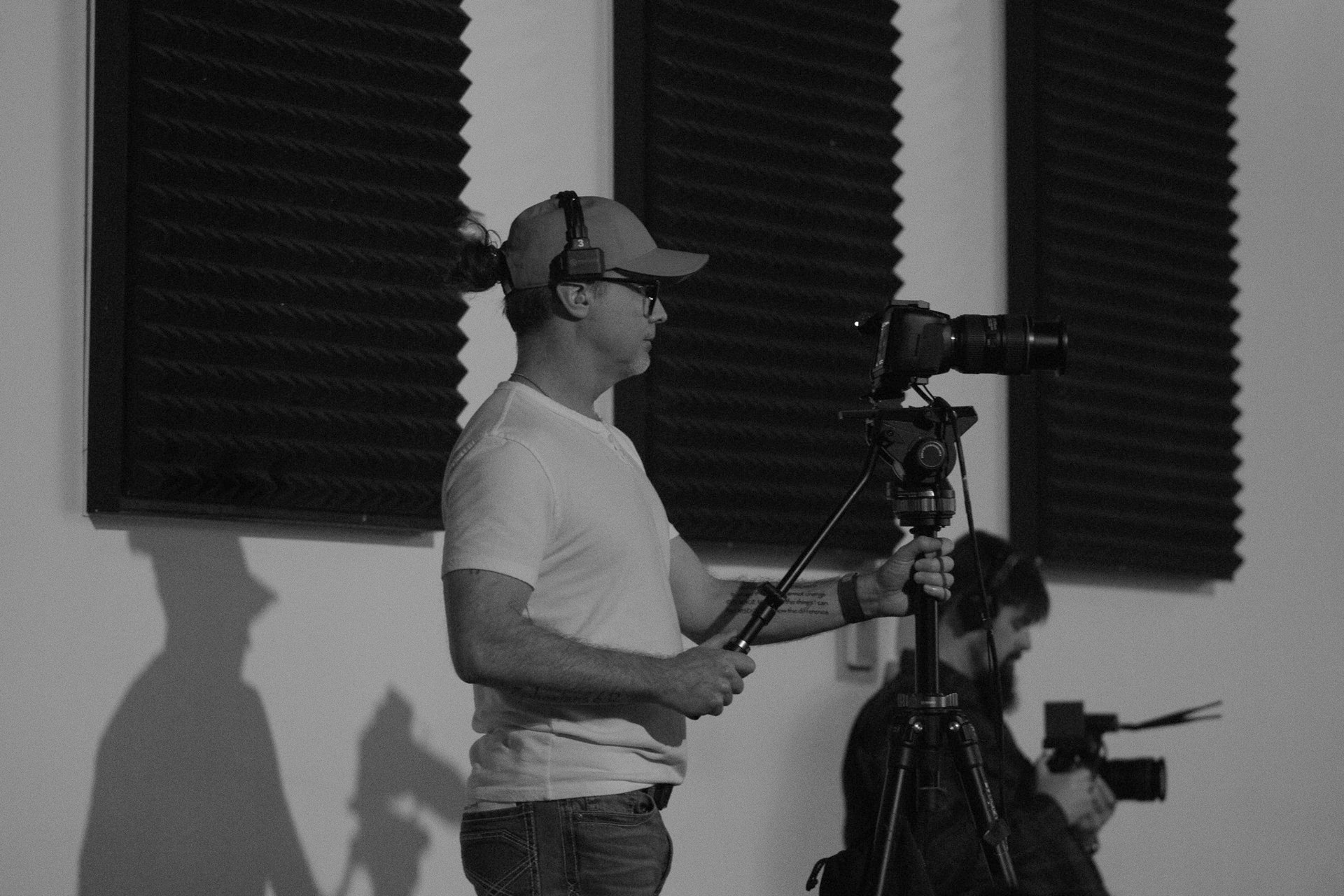 A volunteer operating a video camera at Mercy Road Church